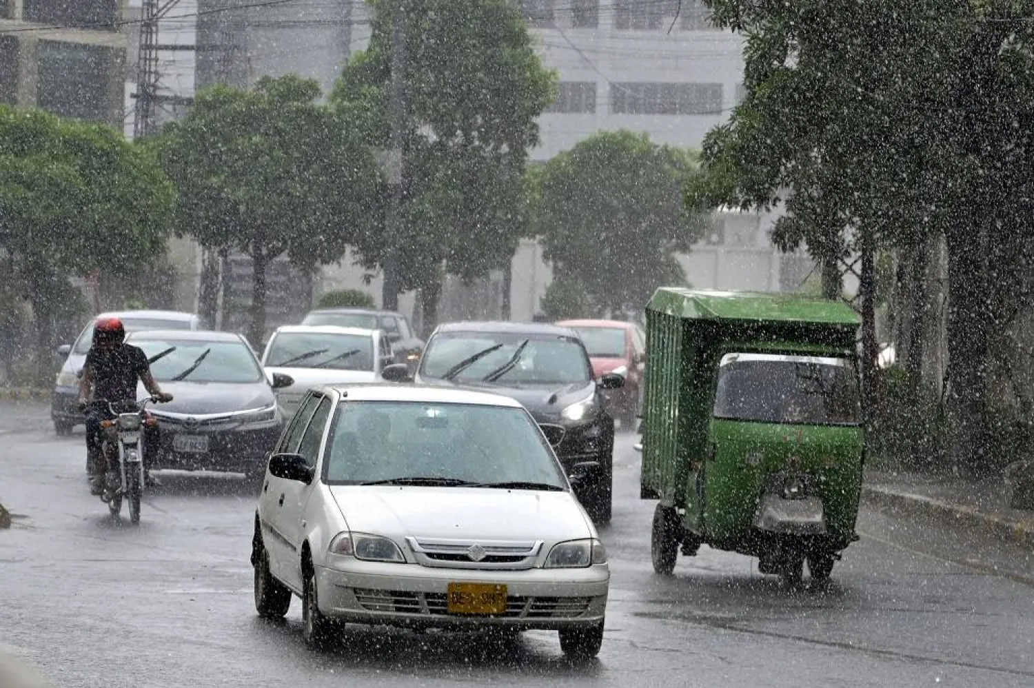 Vehicles drive amid rainfall in Lahore, Pakistan, 09 August 2025. (EPA)