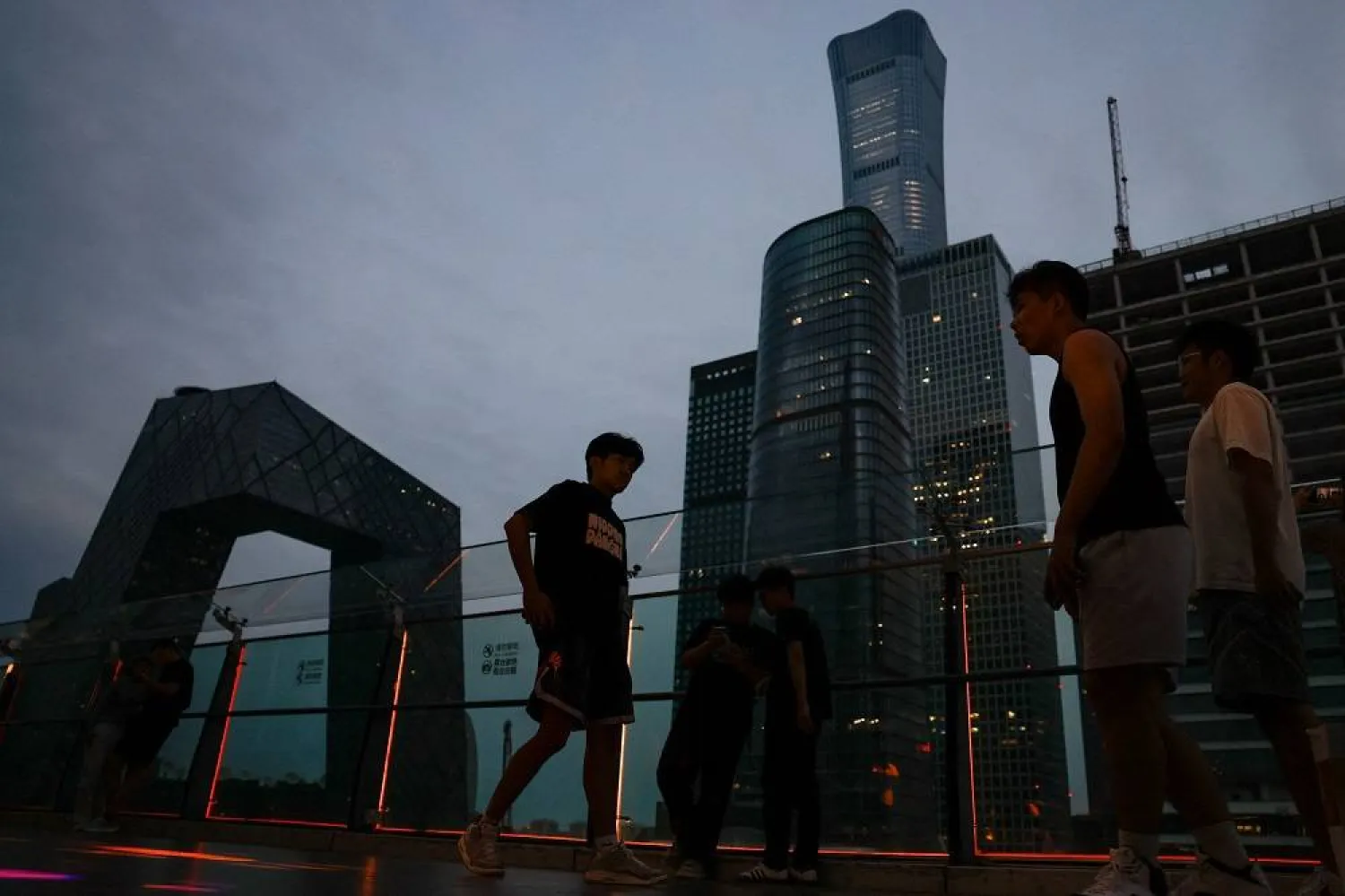 People walk on a terrace of a shopping mall at the central business district (CBD), in Beijing, China August 11, 2025. (Reuters)