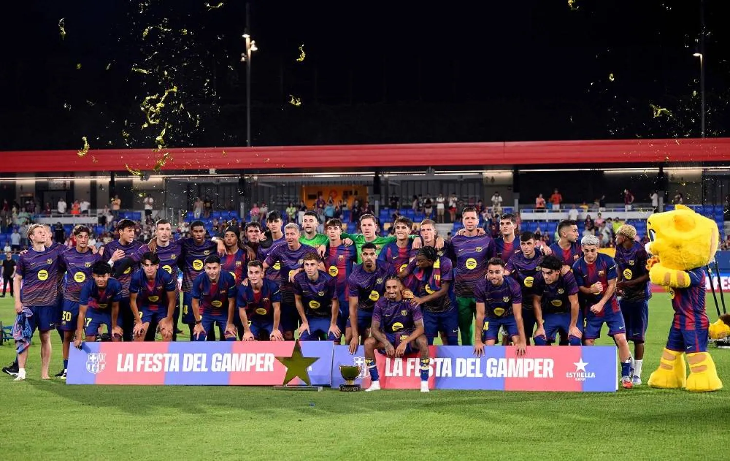 Barcelona players pose with their trophy after winning the 60th Joan Gamper Trophy football match between FC Barcelona and Como 1907 at Johan Cruyff Stadium in Barcelona on August 10, 2025. (AFP)