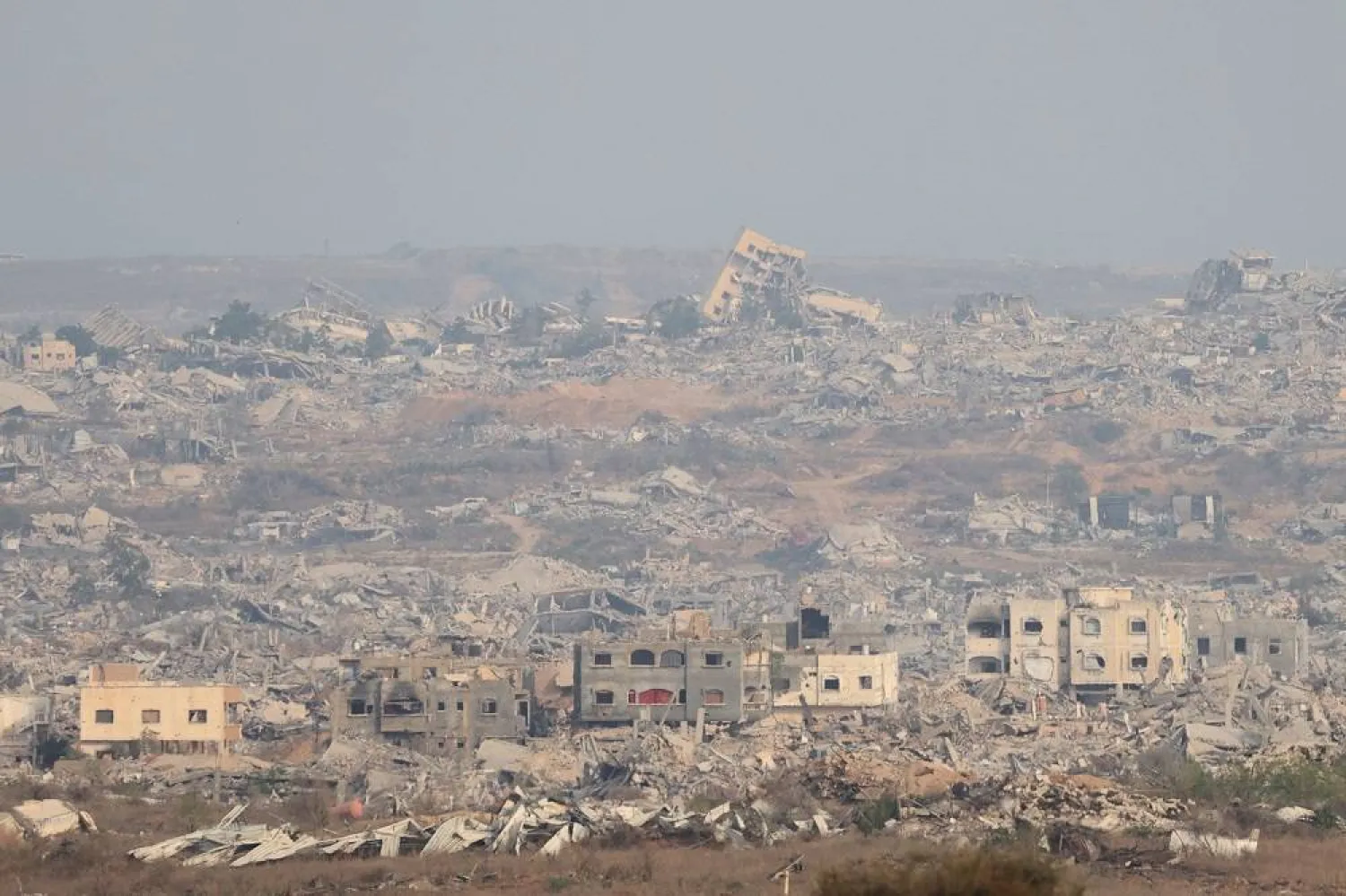 Destroyed buildings inside Gaza, as seen from the Israeli side, near the border with Gaza Strip, in southern Israel, 12 August 2025. (EPA)