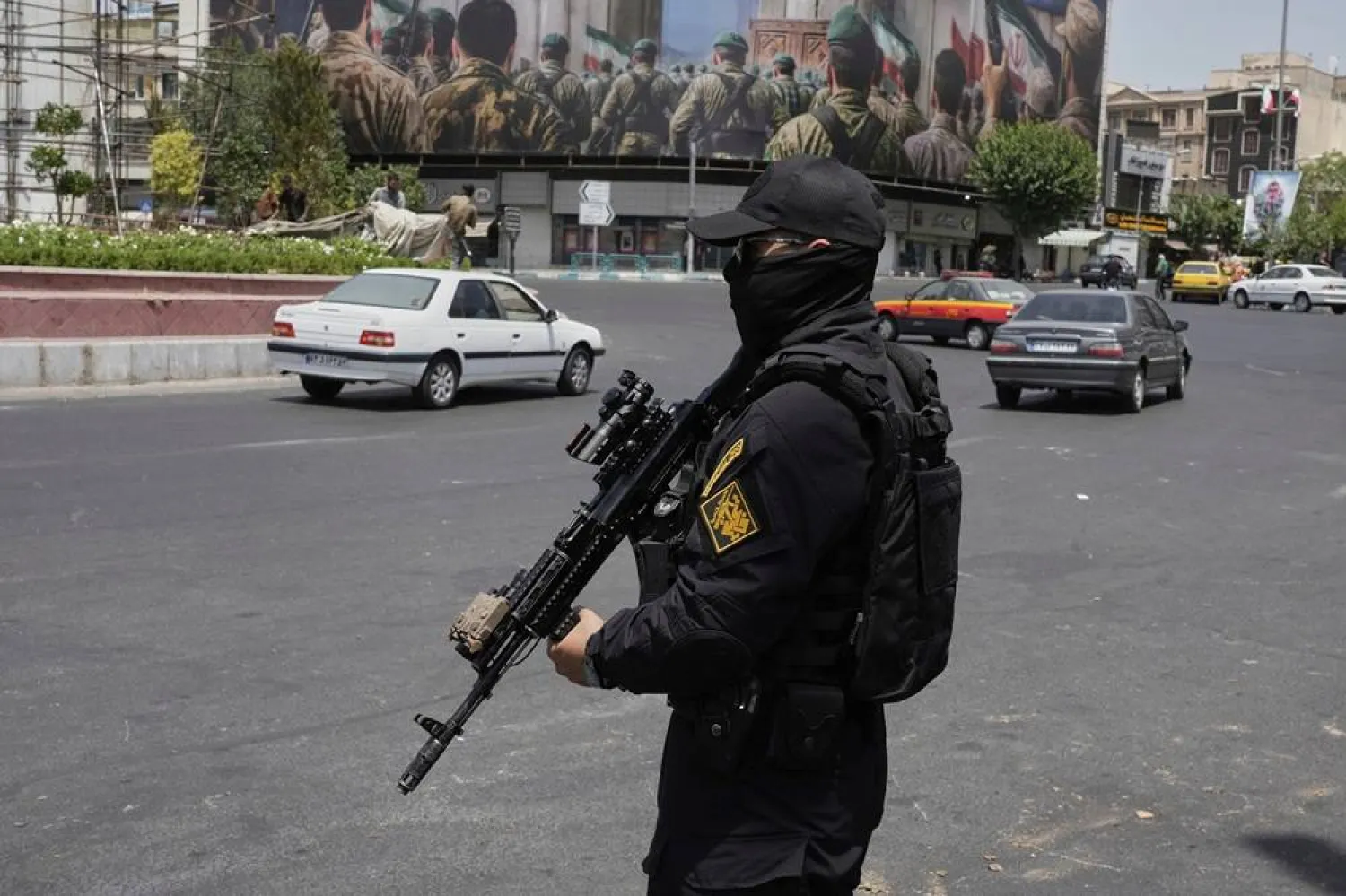 A member of Iran's Revolutionary Guard stands guard at Enqelab-e-Eslami square in downtown Tehran, Iran, Tuesday, June 24, 2025. (AP)
