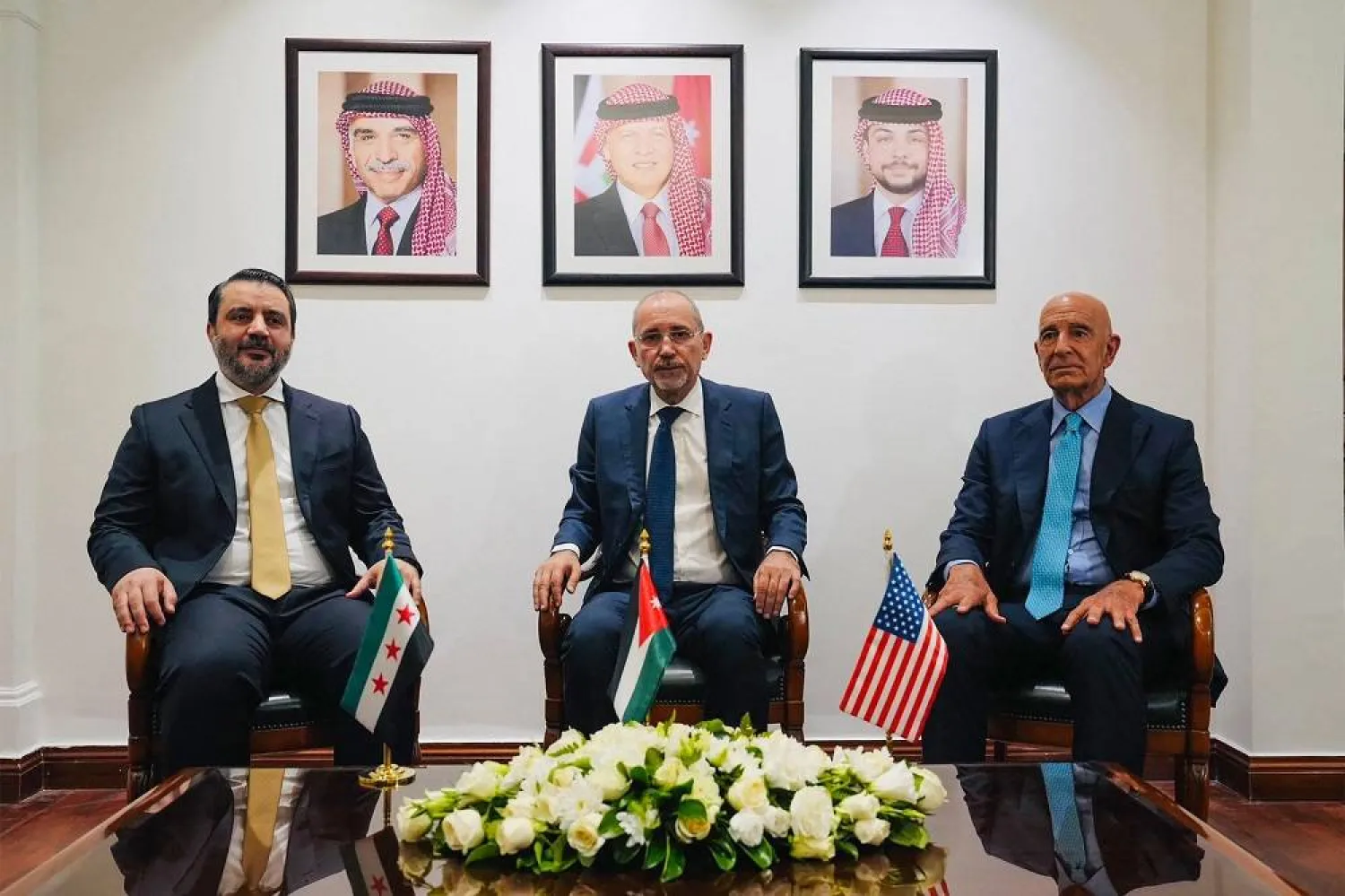 This handout picture released by the Jordanian Foreign Ministry shows (L to R) Syria's interim Foreign Minister Asaad al-Shaibani, Jordan's Foreign Minister Ayman Safadi, and US special envoy for Syria Tom Barrack meeting in Amman on August 12, 2025. (Jordanian Foreign Ministry / AFP) 