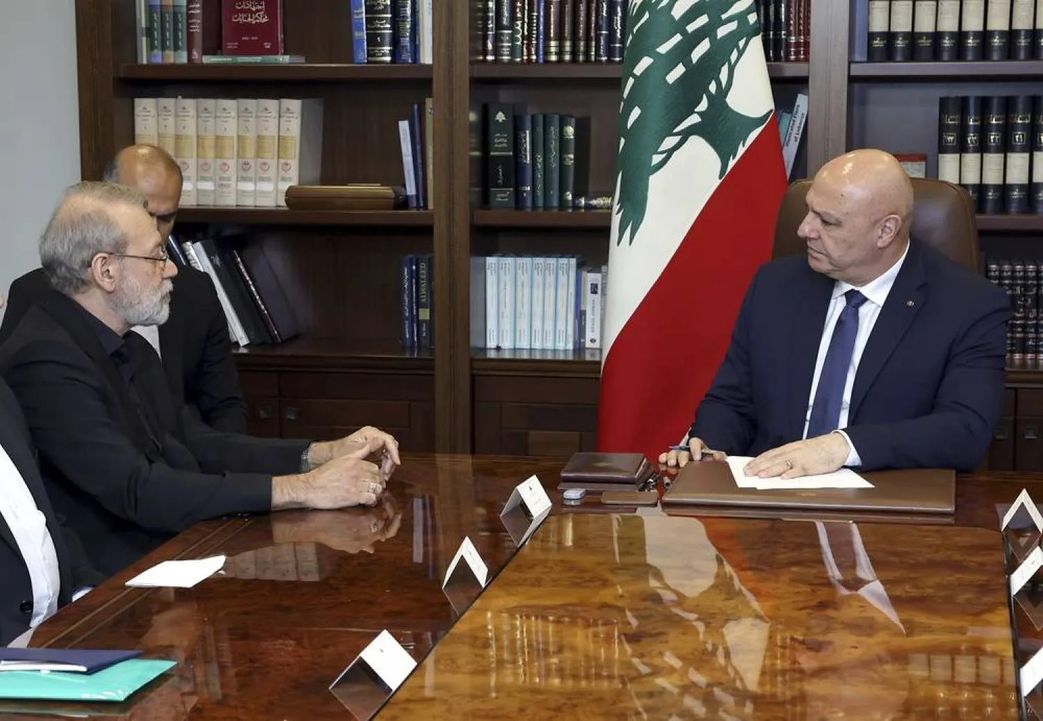In this photo, released by the Lebanese Presidency press office, Lebanese President Joseph Aoun, right, meets with Iranian Secretary of Supreme National Security Council Ali Larijani, at the presidential palace in Baabda, east of Beirut, Lebanon, Wednesday, Aug. 13, 2025. (Lebanese Presidency press office via AP) 