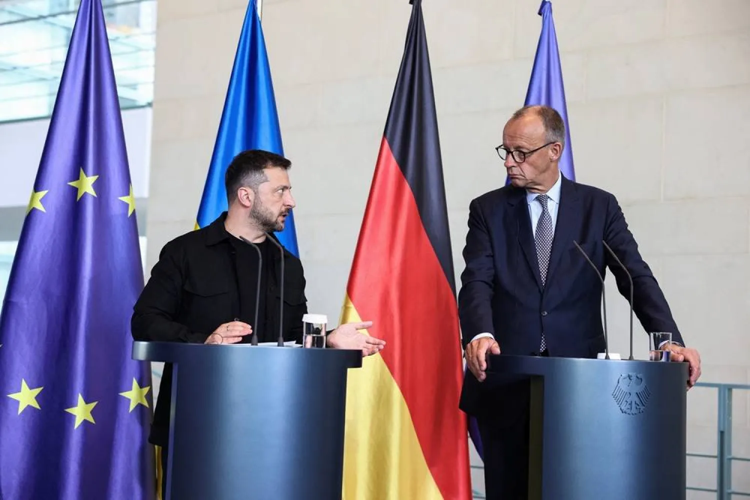 German Chancellor Friedrich Merz and Ukrainian President Volodymyr Zelenskyy attend a press conference, on the day they attend a virtual meeting with US President Donald Trump and European leaders on the upcoming Trump-Putin summit on Ukraine, in Berlin, Germany, August 13, 2025. (Reuters) 