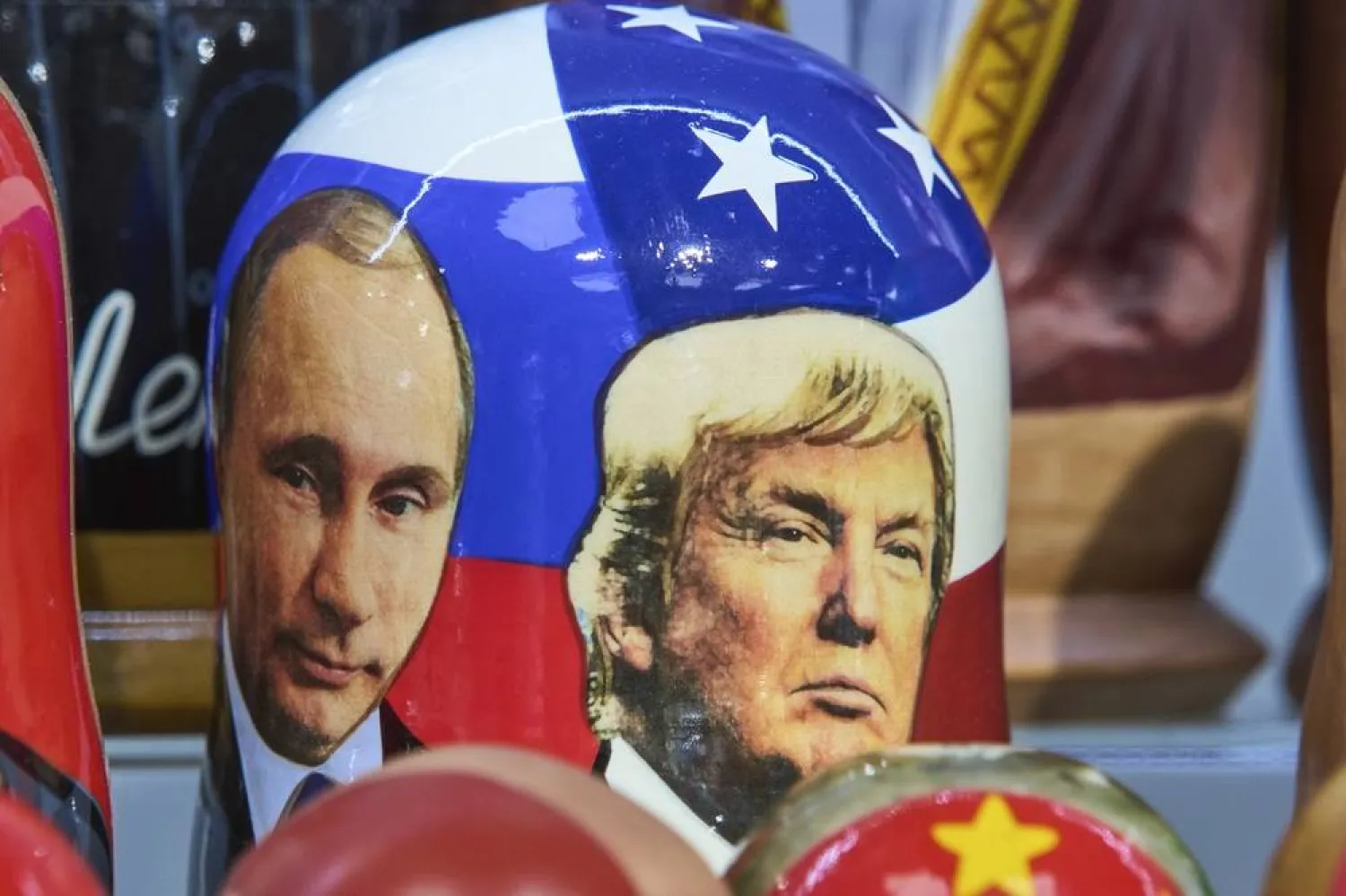 Traditional Russian wooden dolls called Matryoshka depicting Russian President Vladimir Putin, left, and US President Donald Trump are displayed for sale at a souvenir shop in Moscow, Russia, Tuesday, Aug. 12, 2025. (AP)