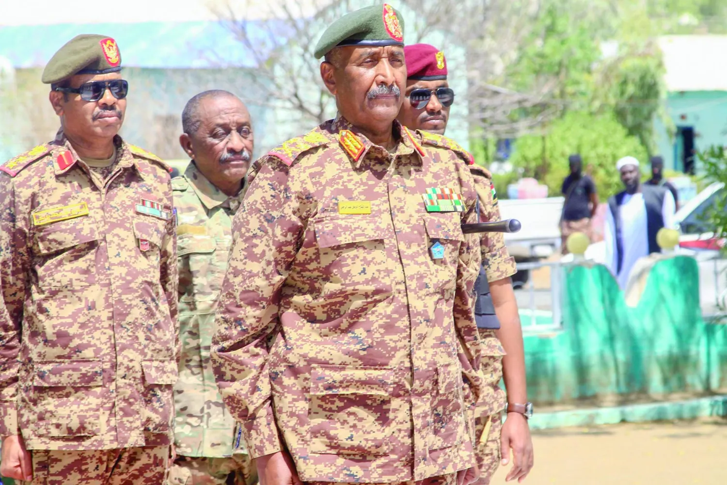 War-torn Sudan's army chief Abdel Fattah al-Burhan visits casualties receiving treatment at a hospital in the southeastern Gedaref state, on the first day of Eid al-Fitr that marks the end of the Islamic fasting month of Ramadan on April 10, 2024. (Photo by AFP)
