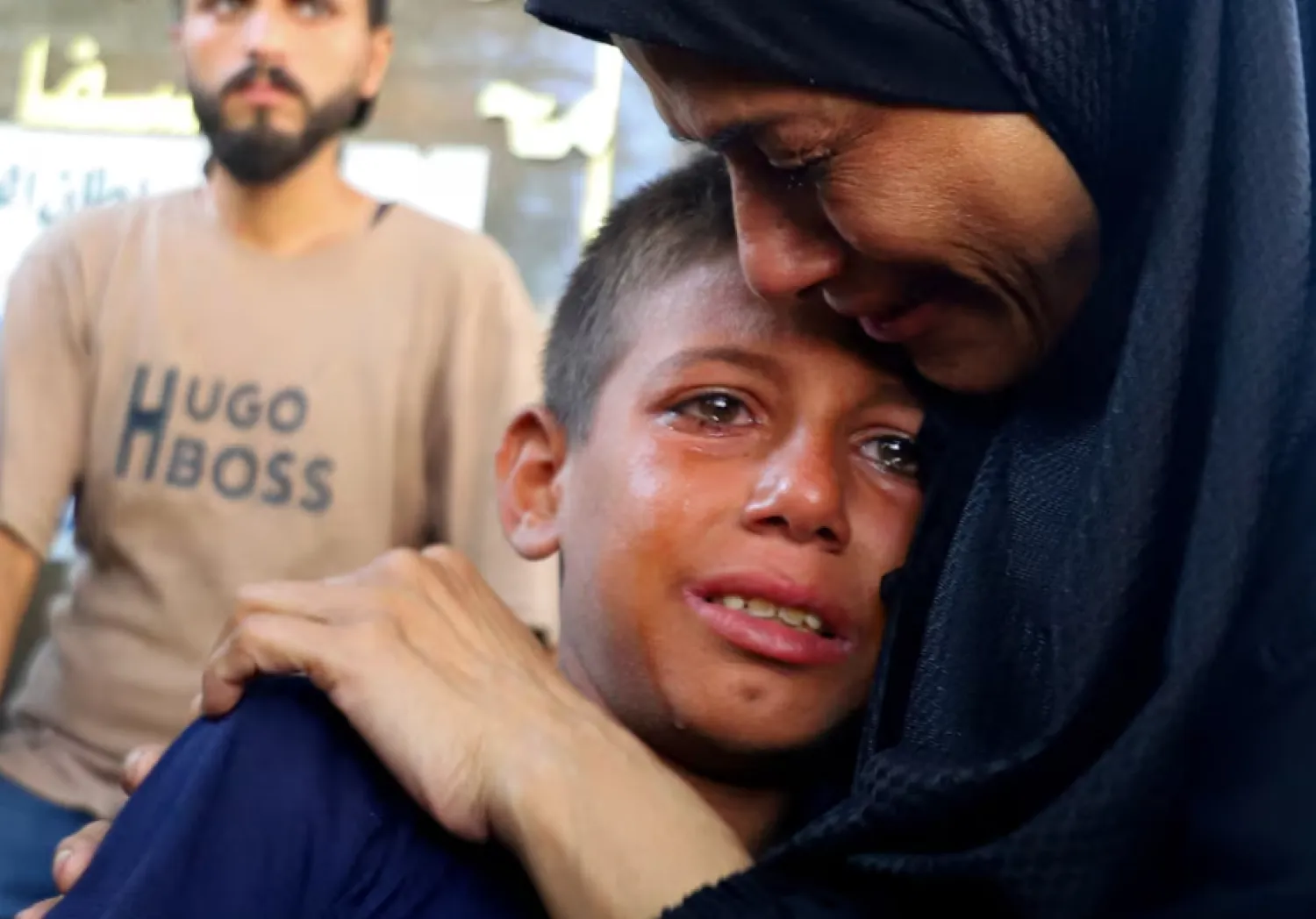 Mourners react during the funeral of Palestinians killed in Israeli fire while seeking aid on Wednesday, according to medics, in Gaza City, August 14, 2025. REUTERS/Ebrahim Hajjaj 