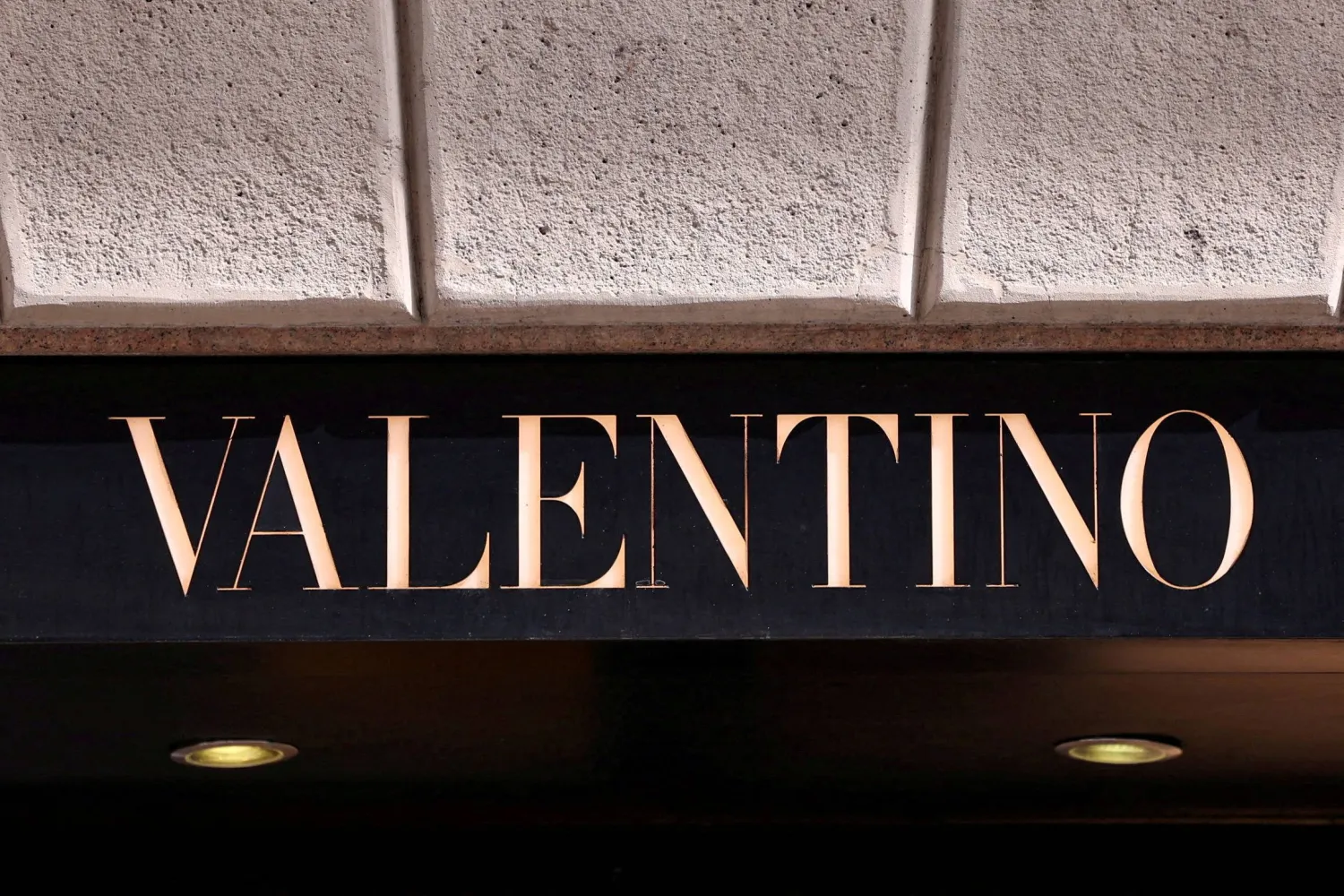 FILE PHOTO: The logo of fashion house Valentino is seen outside a shop in Milan, Italy, April 8, 2024. REUTERS/Claudia Greco/File Photo