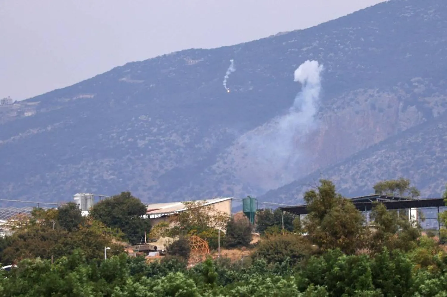 Israeli artillery fire is seen in the Lebanese section of Shebaa. (AFP file)