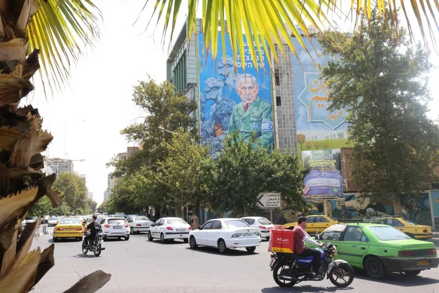  billboard in Tehran shows the word “Hitanyahu” in Farsi and the Hebrew phrase “Today’s German Nazi,” hanging above the Iranian-Palestinian coordination center (AFP)