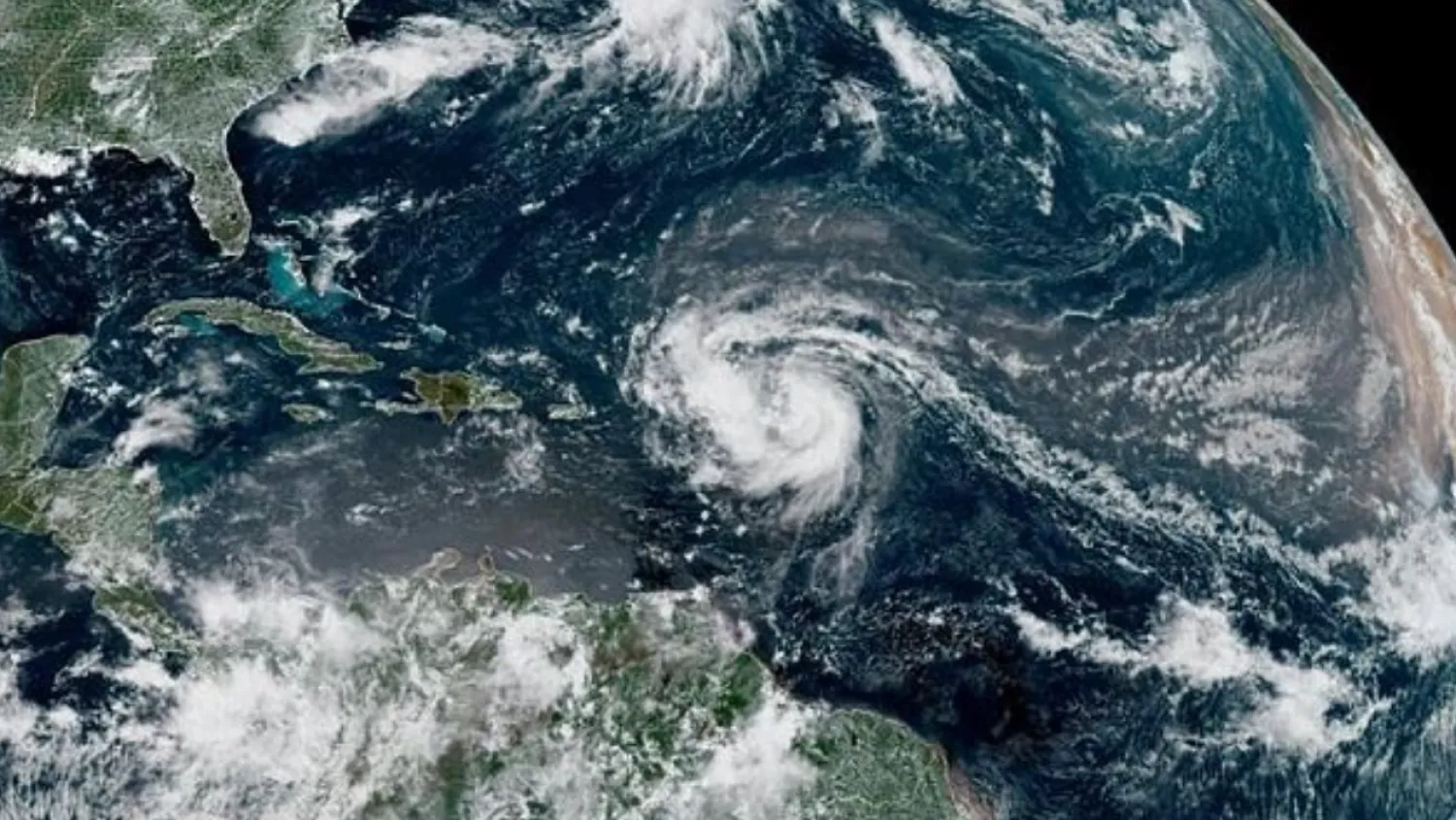 This satellite image provided by the National Oceanic and Atmospheric Administration shows Hurricane Erin forming in the Atlantic Ocean - AFP

