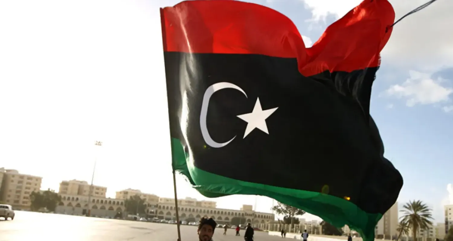Man waving the Libyan flag - File Photo/AFP
