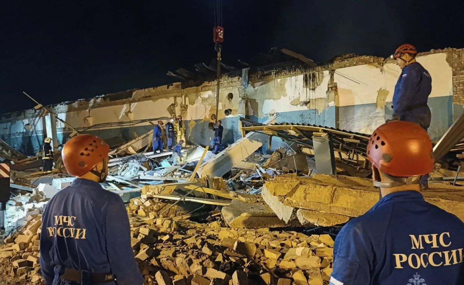 In this photo, released by the Russian Emergency Ministry Press Service on Saturday, Aug. 16, 2025, Emergency Ministry employees work in debris of an industrial plant after a fire at the facility in the Shilovsky District, Ryazan region, around 250 kilometers (155 miles) southeast of Moscow, Russia. (Russian Emergency Ministry Press Service via AP)
