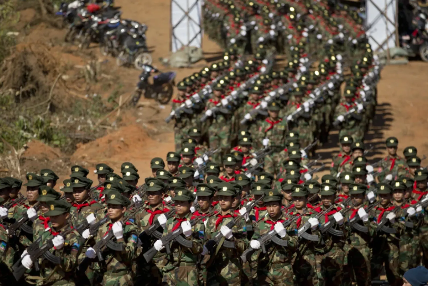 Ta’ang National Liberation army officers march during a function to mark 52nd Ta’ang revolution day in Mar-Wong, Ta’ang self-governing area, northern Shan state, Myanmar, Jan. 12, 2015. (AP Photo/Gemunu Amarasinghe, File)

