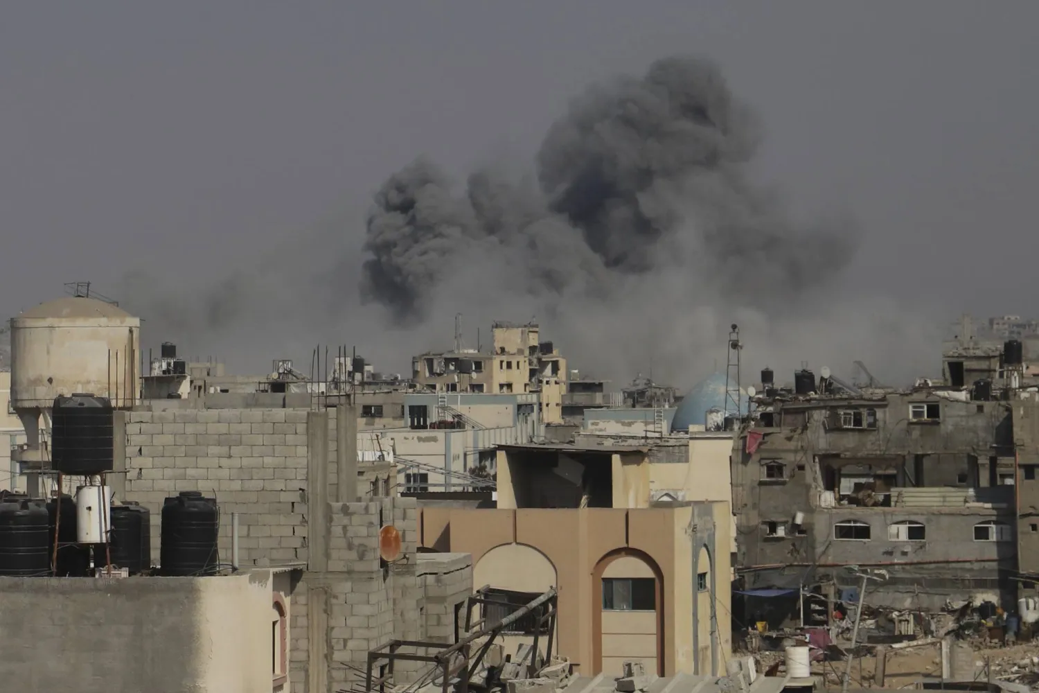 Smoke rises to the sky following an Israeli army airstrike in Khan Younis, in the Gaza Strip, Friday, Aug. 15, 2025. (AP Photo/Mariam Dagga)
