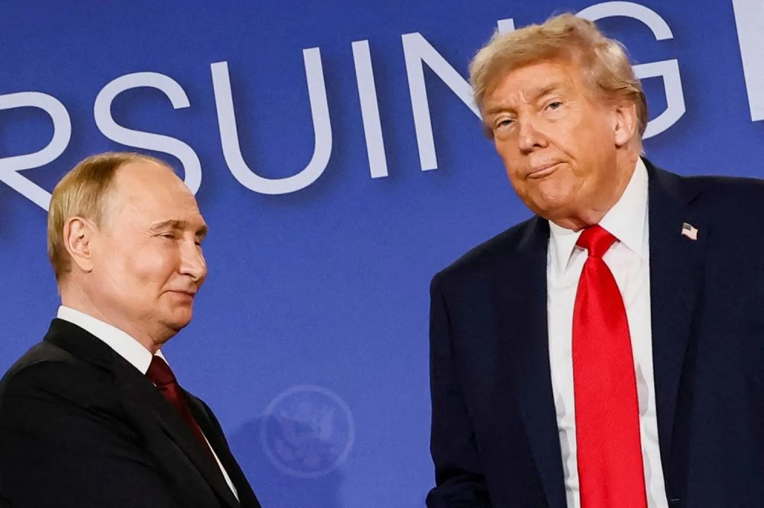 US President Donald Trump looks on next to Russian President Vladimir Putin during a press conference following their meeting to negotiate an end to the war in Ukraine, at Joint Base Elmendorf-Richardson, in Anchorage, Alaska, US, August 15, 2025. (Reuters)