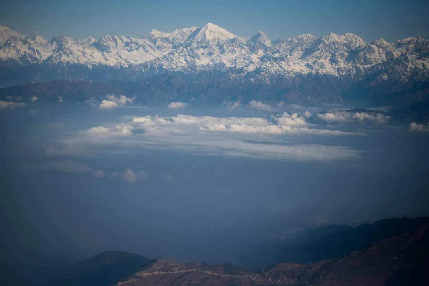 (FILES) This picture taken from a commercial aircraft shows an aerial view of the Himalayan mountain range near Kathmandu on February 7, 2020. (Photo by Jewel SAMAD / AFP)