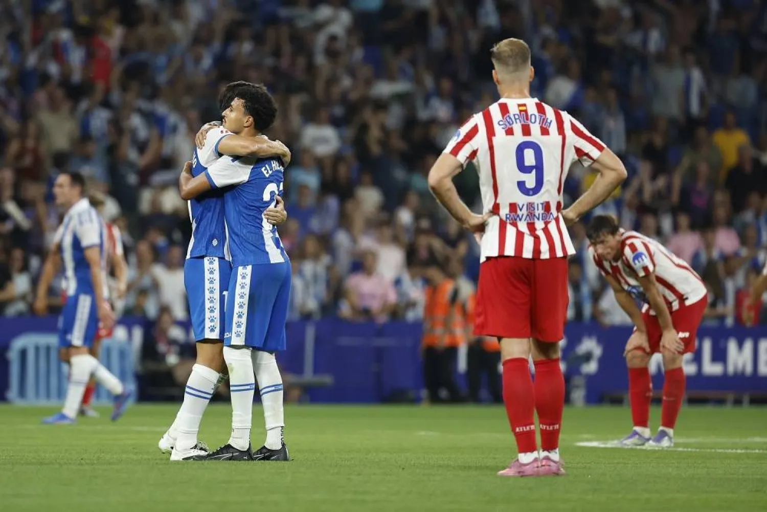 Espanyol's players celebrate at the end of the Spanish LaLiga soccer match between RCD Espanyol and Atletico Madrid, in Barcelona, Spain, 17 August 2025. (EPA)