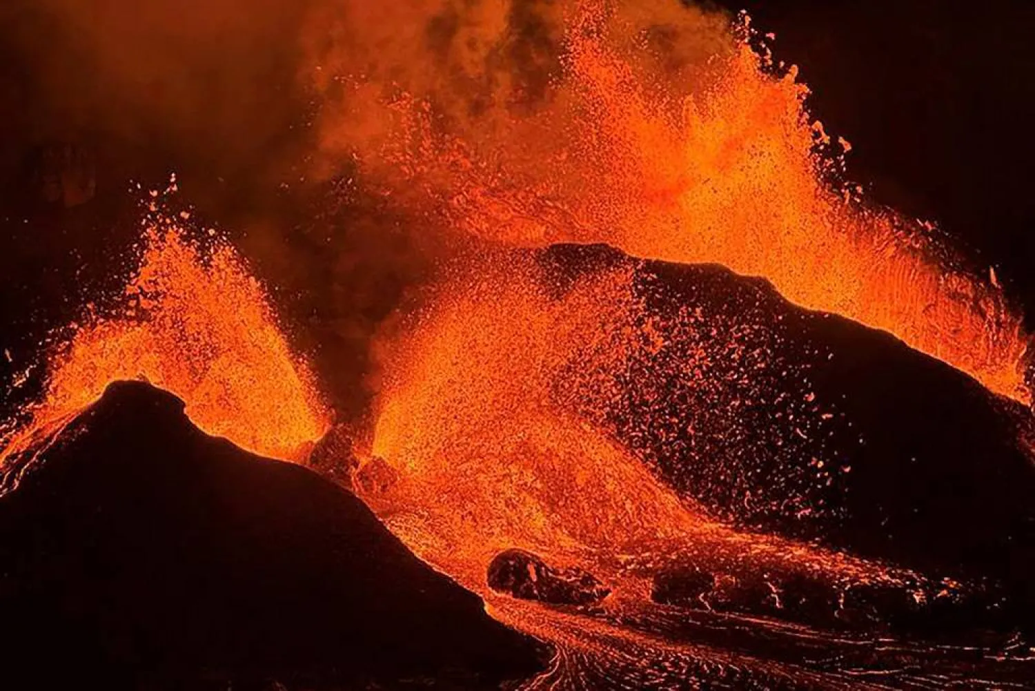 This image provided by the US Geological Survey (USGS) shows evening views of lava fountaining from Haleumaumau Crater at the summit of Kilauea volcano inside Hawaii Volcanoes National Park, Hawaii., Feb. 11, 2025. (M. Patrick/US Geological Survey via AP)