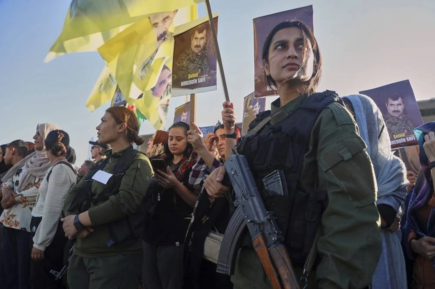 Female fighters from the Syrian Democratic Forces (SDF) attend a military parade before the funeral of senior Kurdistan Workers' Party (PKK) leader Nuredin Sofi, whose body was returned from Iraq's Kurdistan region after he was killed in a strike on Mount Gara in April 2021, in Qamishli, northeastern Syria, Tuesday, Aug. 12, 2025. (AP) 