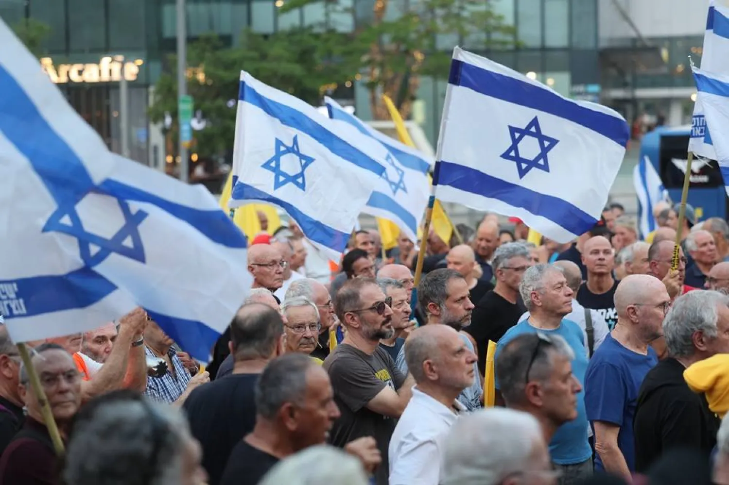 Reservists and former pilots from the Israel Air Force take part in a protest outside the Kirya military headquarters in Tel Aviv, Israel, 12 August 2025. (EPA)