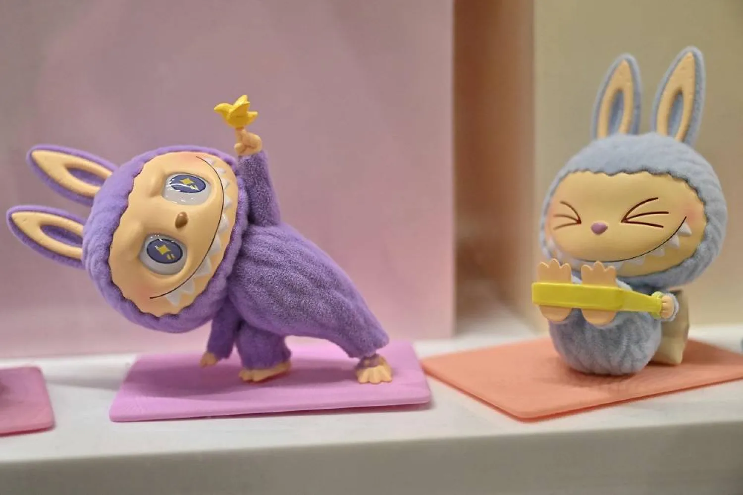 This photograph shows a view of Labubu elves, collectible plush toys designed by Hong Kong illustrator Kasing Lung as part of his series "The Monsters", displayed at a Pop Mart shop in Paris on August 17, 2025. (AFP)