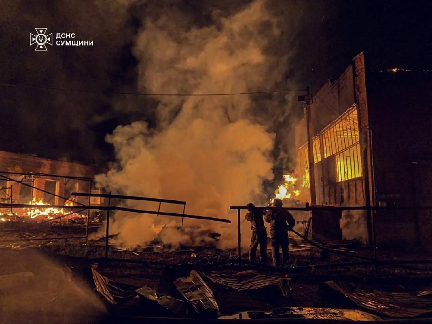This handout photograph taken and released by the Ukrainian Emergency Service on August 20, 2025, shows Ukrainian emergency workers in action following an air attack, in Okhtyrka, Sumy region, amid the Russian invasion of Ukraine. (Handout / Ukrainian Emergency Service / AFP) 