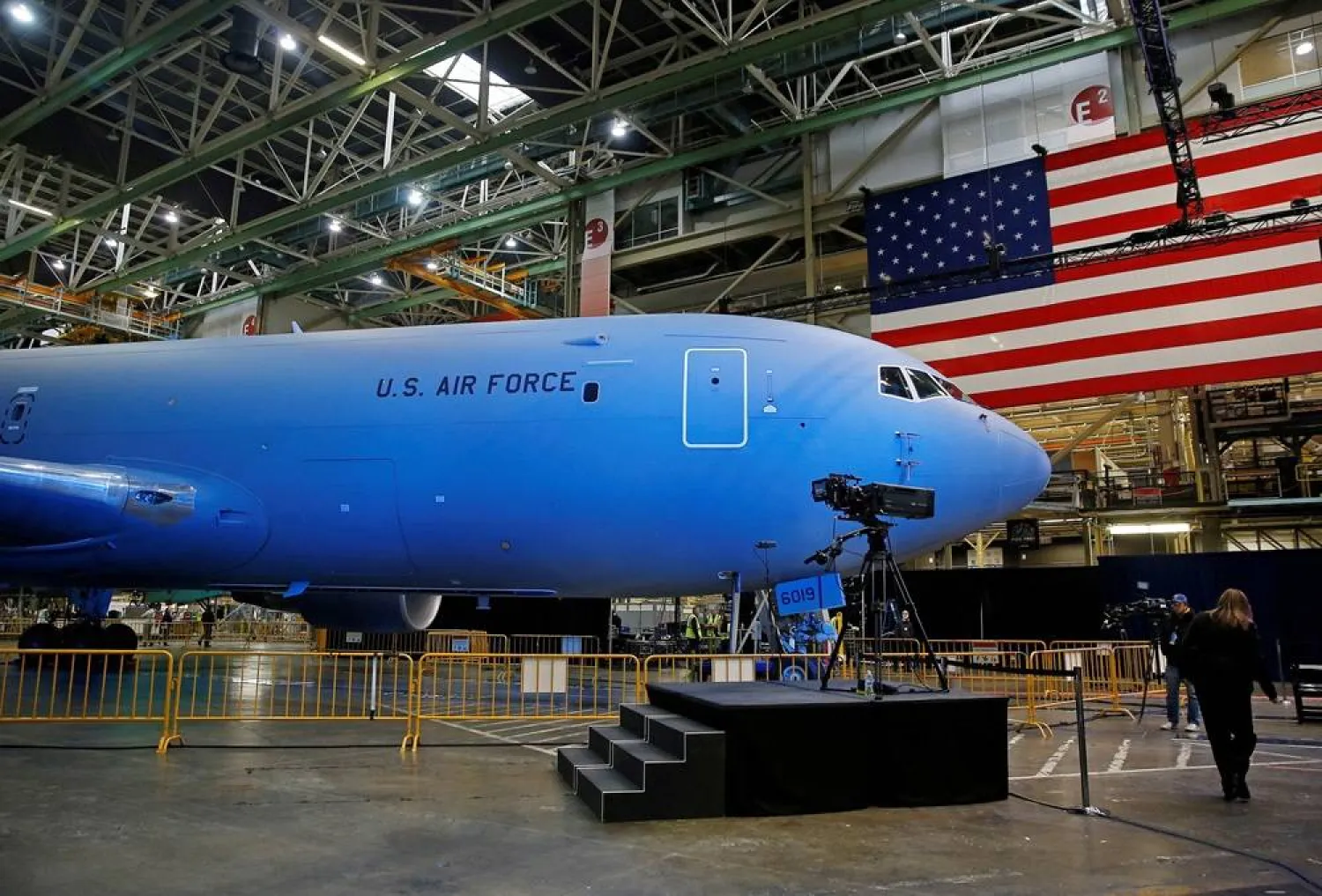 he Boeing KC-46 Pegasus aerial refueling tanker is bathed in blue light before a delivery celebration to the US Air Force in Everett, Washington, US, January 24, 2019. (Reuters)