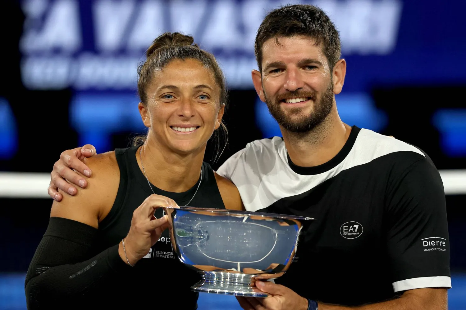 NEW YORK, NEW YORK - AUGUST 20: Sara Errani and Andrea Vavassori of Italy pose with their trophy after defeating Iga Swiatek of Poland and Casper Ruud of Norway during the Mixed Doubles Finals of the US Open at USTA Billie Jean King National Tennis Center on August 20, 2025 in New York City. Matthew Stockman/Getty Images/AFP