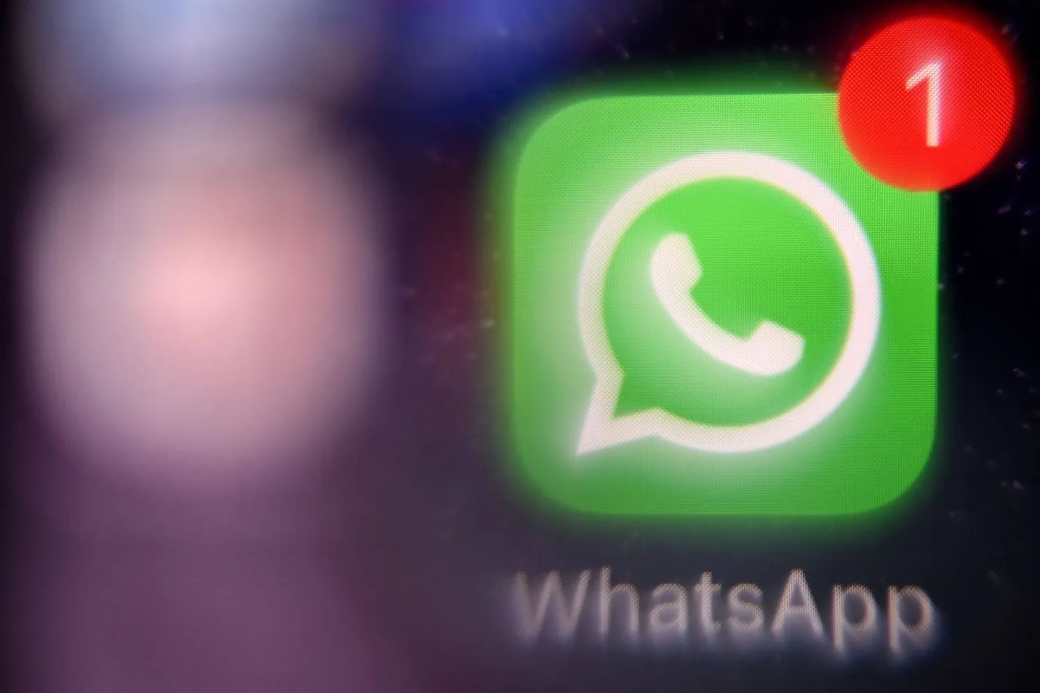 (FILES) This photograph taken on March 23, 2022 shows the mobile US instant messaging software Whatsapp logo on a smartphone screen in Moscow. (Photo by AFP)