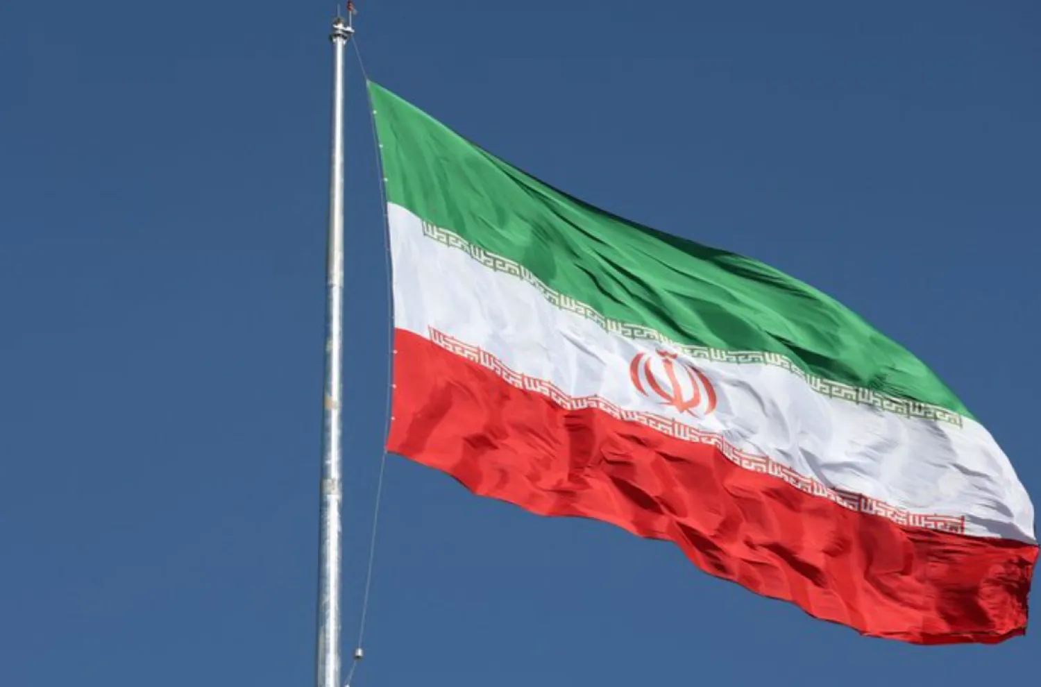 The Iranian flag is seen flying over a street in Tehran, Iran, February 3, 2023. Majid Asgaripour/WANA (West Asia News Agency) via REUTERS/ File Photo 