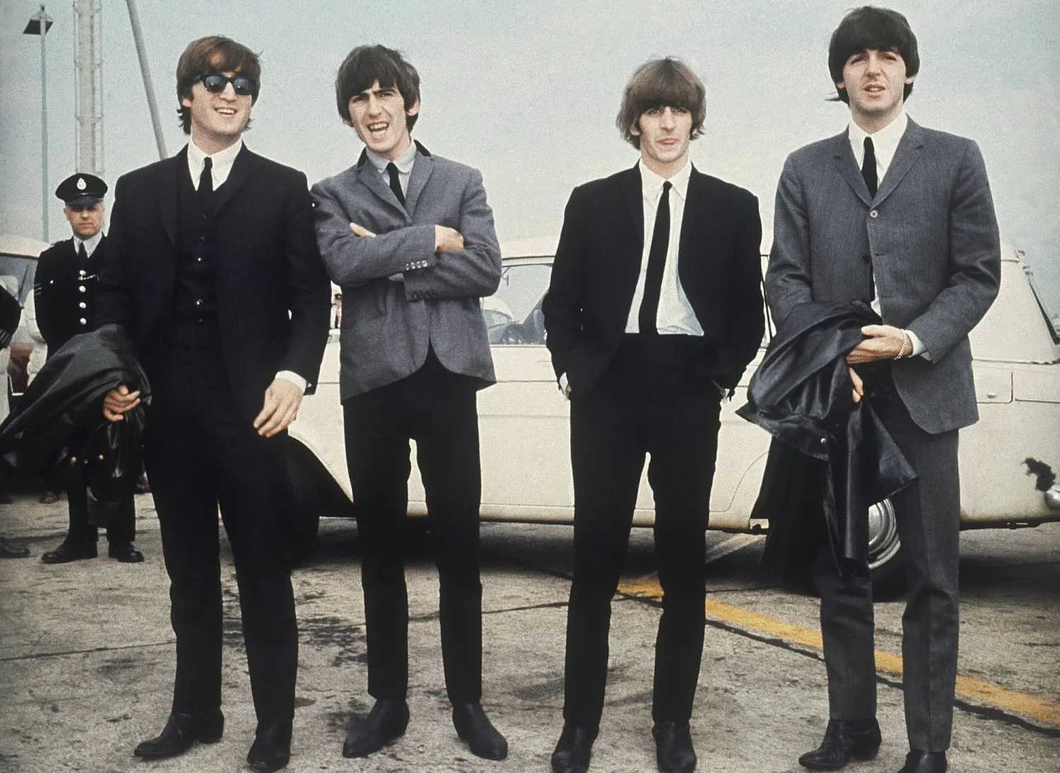 FILE - The Beatles, from left, John Lennon, George Harrison, Ringo Starr and Paul McCartney arrive in Liverpool, England, July 10, 1964. (AP Photo, File)