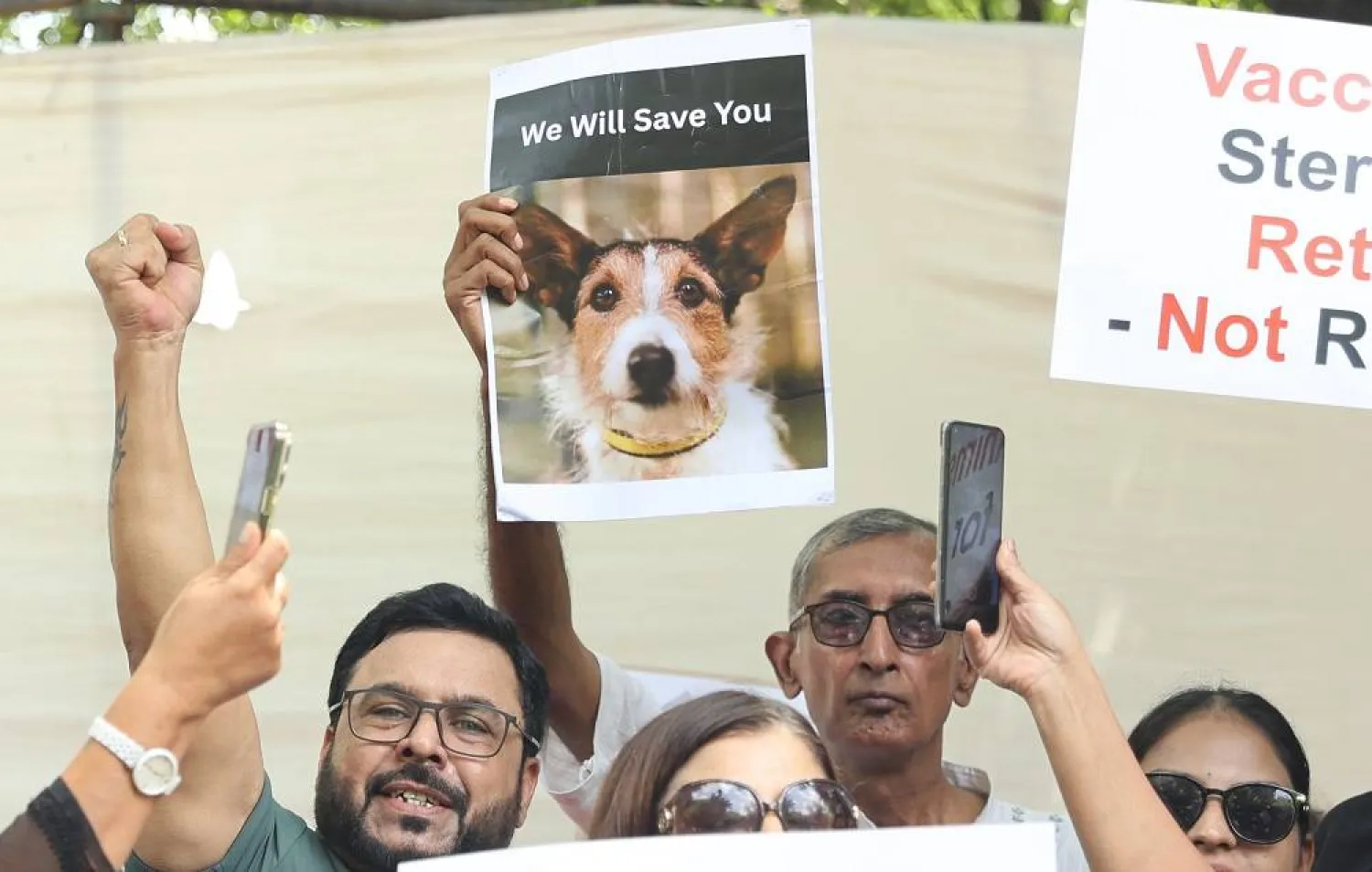 People protest in solidarity with stray dogs in New Delhi, India, 21 August 2025. (EPA)