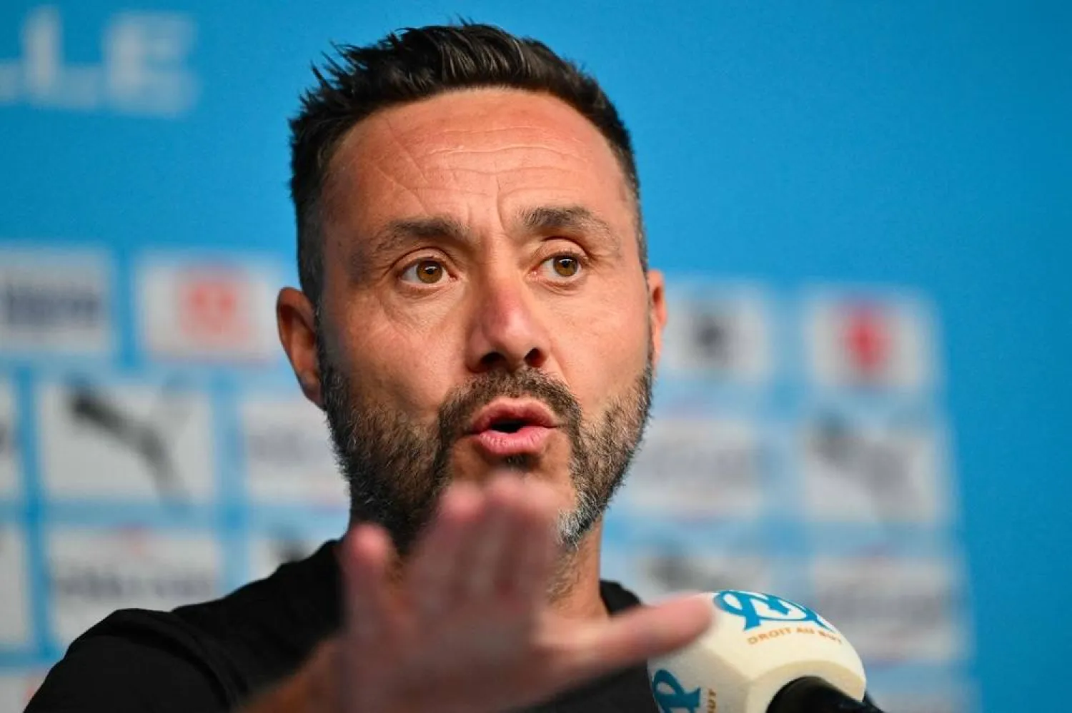 Marseille's Italian head coach Roberto De Zerbi gestures during a press conference at the Robert-Louis-Dreyfus training center also known as "La Commanderie", in Marseille, southern France on August 22, 2025. (AFP) 