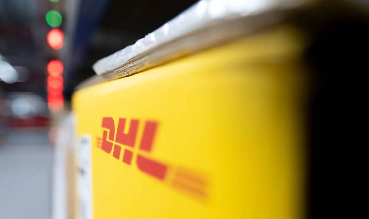 22 May 2024, Saxony, Schkeuditz: The logo of DHL is seen on a package in Saxony's DHL Hub. (dpa) 