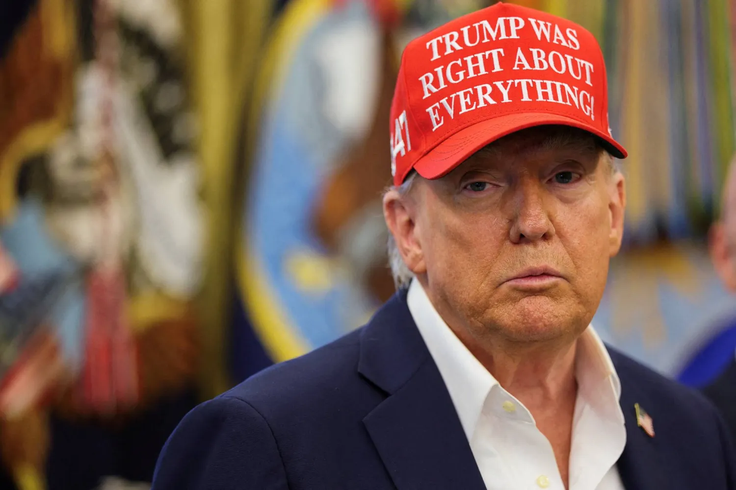 FILE PHOTO: US President Donald Trump wears a 'Trump Was Right About Everything!' hat, as he makes an announcement on the 2026 FIFA World Cup, in the Oval Office at the White House in Washington, D.C., US, August 22, 2025. REUTERS/Jonathan Ernst/File Photo