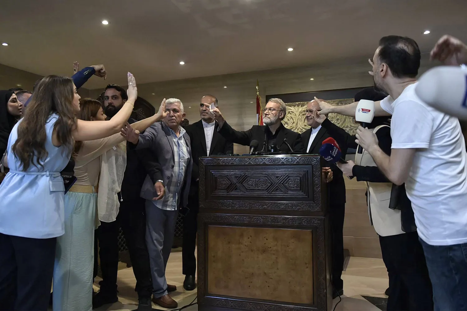 Iran's Supreme National Security Council chief Ali Larijani (C) speaks to reporters in Beirut on August 13, 2025. (Photo by AFP)