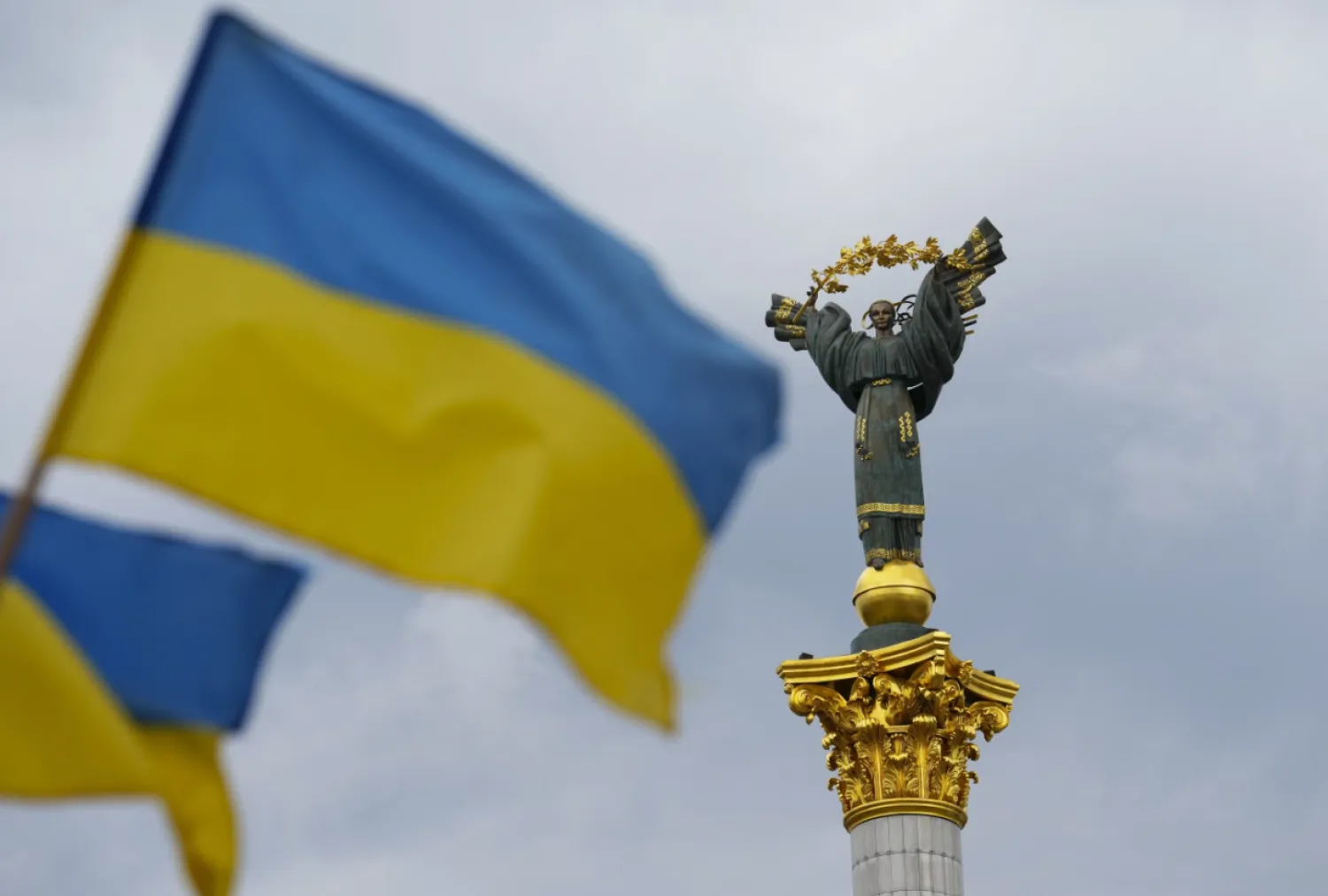 The Independence Monument is pictured as Ukrainian flags blow in the wind in Kyiv, Ukraine, on Saturday, Aug. 23, 2025. (Sean Kilpatrick/The Canadian Press via AP)