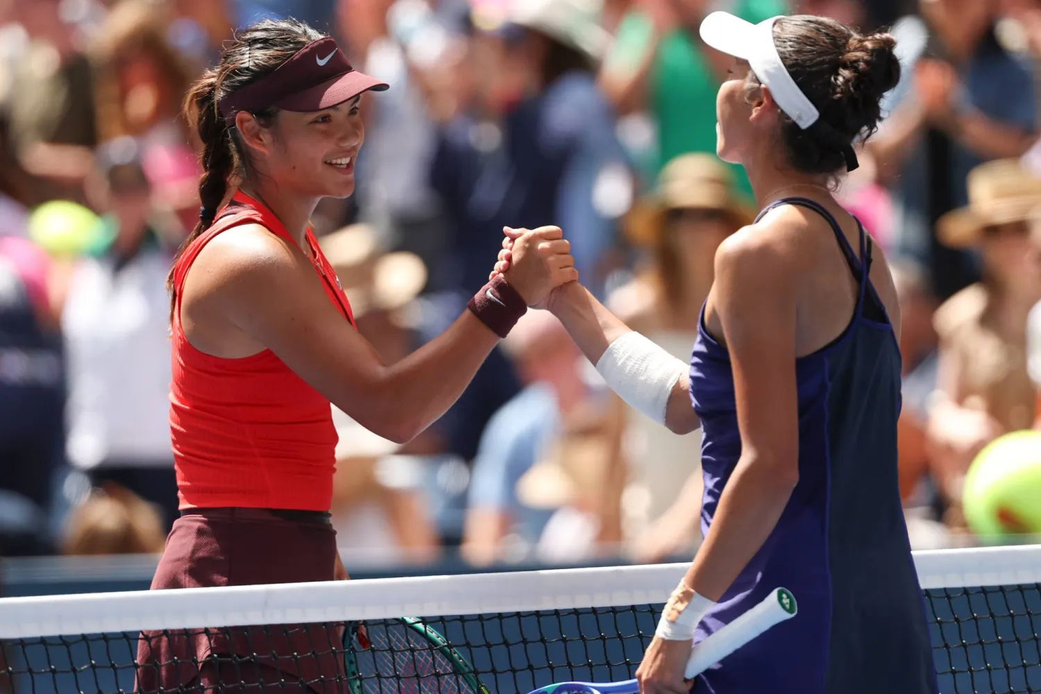 Emma Raducanu of Great Britain (L) shakes hands with Ena Shibahara of Japan at the net after Raducanu defeated Shibahara during the first round of the US Open Tennis Championships at the USTA Billie Jean King National Tennis Center in Flushing Meadows, New York, USA, 24  August 2025.  EPA/BRIAN HIRSCHFELD
