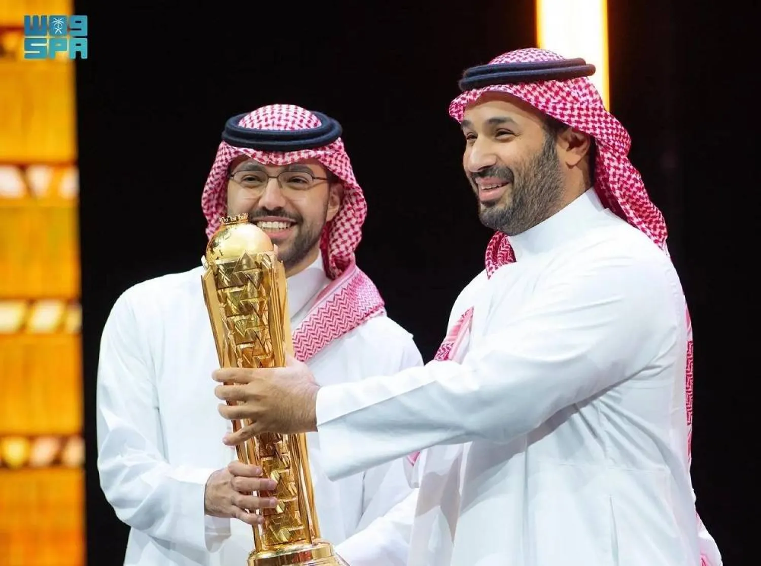 Crown Prince Mohammed bin Salman presents the Team Falcons leader with the trophy. (SPA)