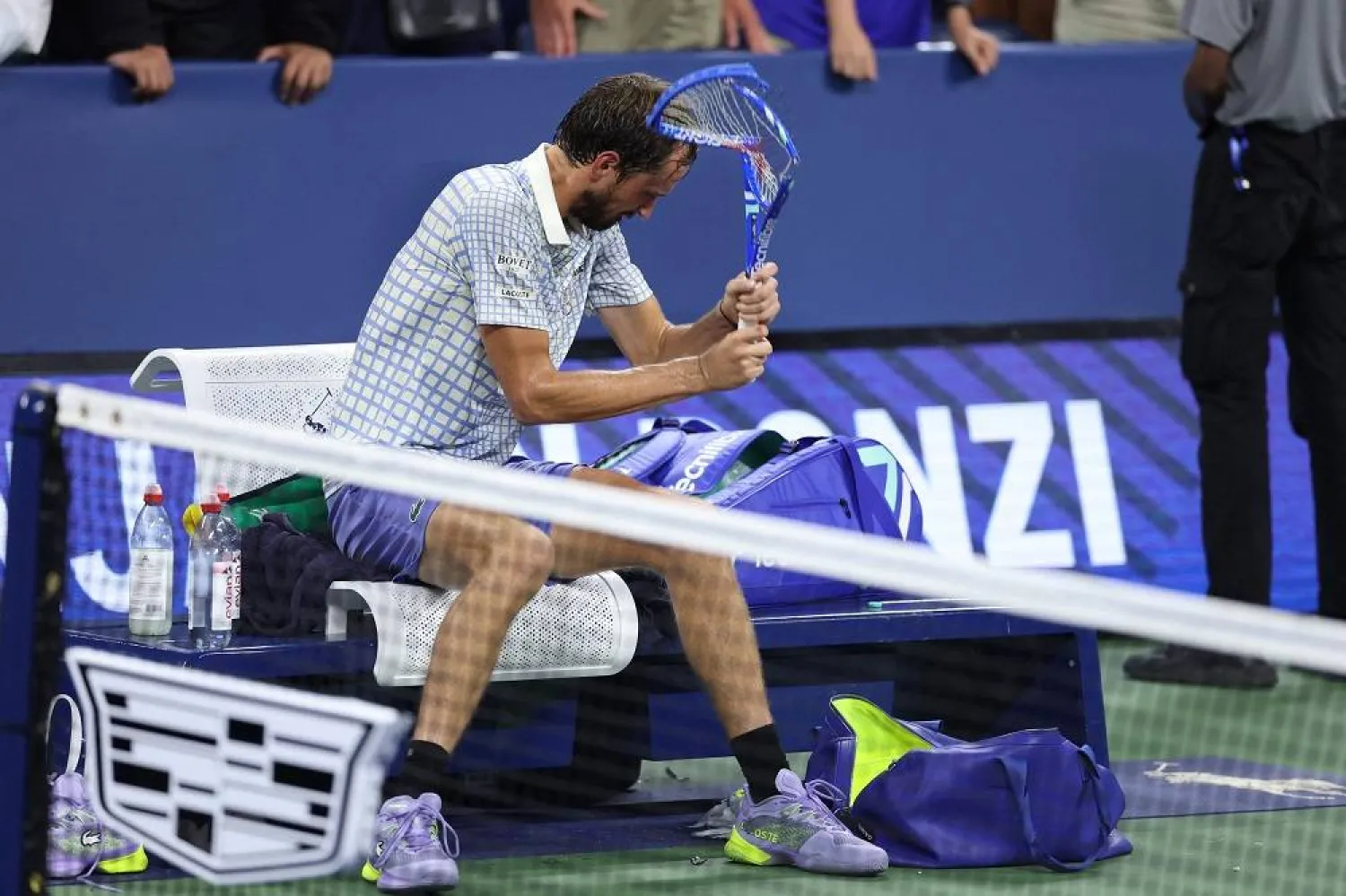 Russia's Daniil Medvedev breaks his racket after losing his men's singles first round tennis match against France's Benjamin Bonzi on day one of the US Open tennis tournament at the USTA Billie Jean King National Tennis Center in New York City, on August 24, 2025. (AFP)