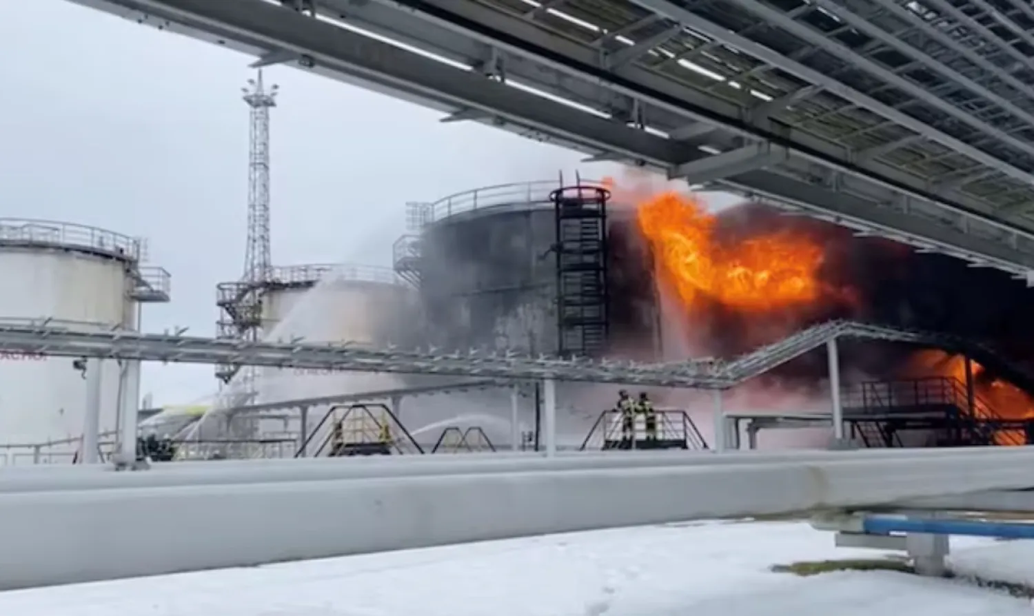 Firefighters extinguish oil tanks at a storage facility that local authorities say caught fire after the military brought down a Ukrainian drone, in the town of Klintsy in the Bryansk Region, Russia January 19, 2024, in this still image taken from video. Russian Emergencies Ministry/Handout via REUTERS/File Photo 