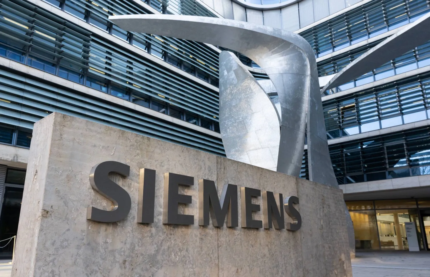 FILED - 09 February 2023, Bavaria, Munich: Siemens logo can be seen in front of the company headquarters. Photo: Sven Hoppe/dpa