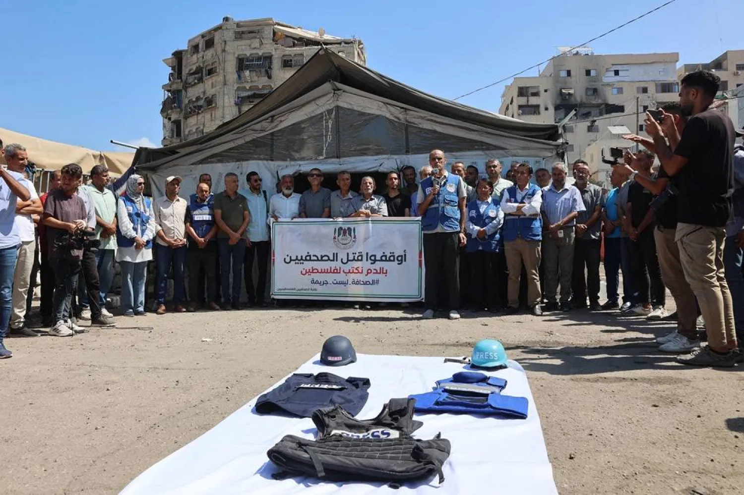Demonstrators gather in solidarity with journalists killed by Israeli strikes in the Gaza Strip, during a protest organized by the Gaza Journalists Syndicate, in Gaza City, on August 26, 2025. (AFP)