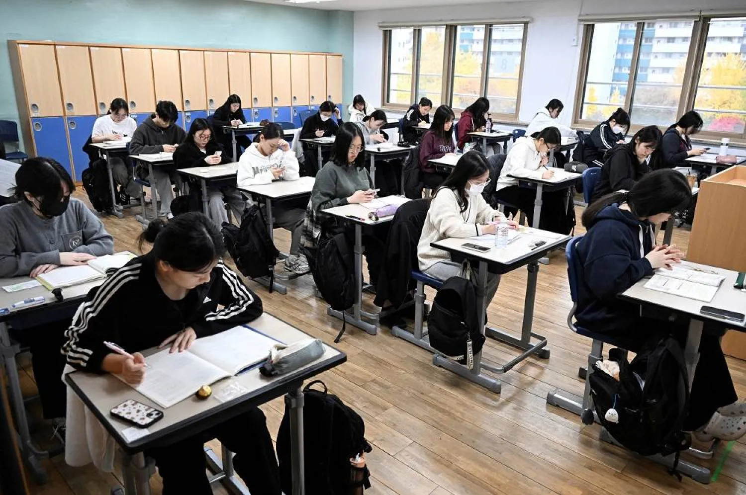 South Korean students wait to take the annual College Scholastic Ability Test at a school in Seoul, South Korea, November 14, 2024. (Reuters)