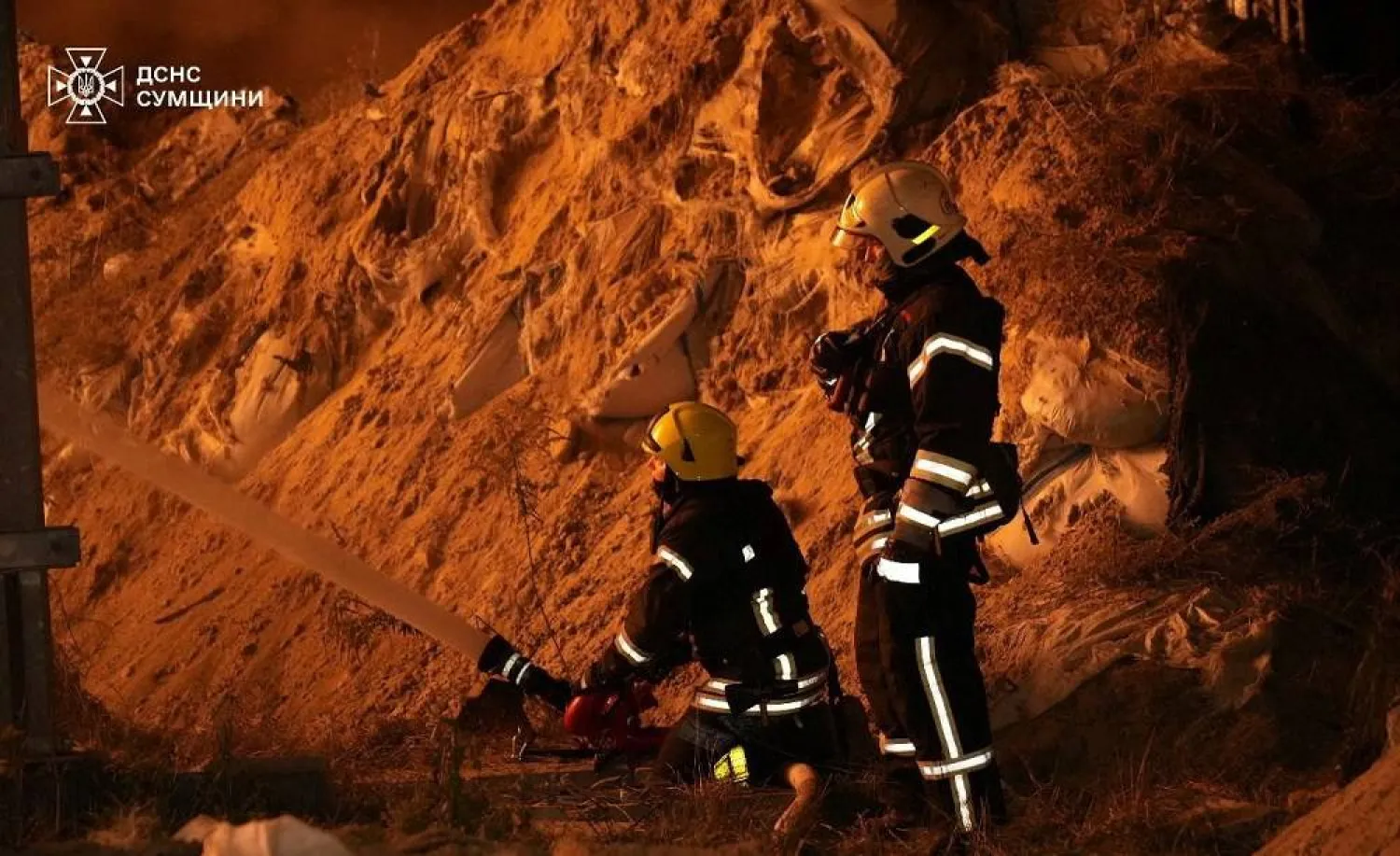 Firefighters work at the site of a Russian drone strike, amid Russia's attack on Ukraine, in Sumy region, Ukraine, in this handout picture released August 27, 2025. (Press service of the State Emergency Service of Ukraine in Sumy region/Handout via Reuters)