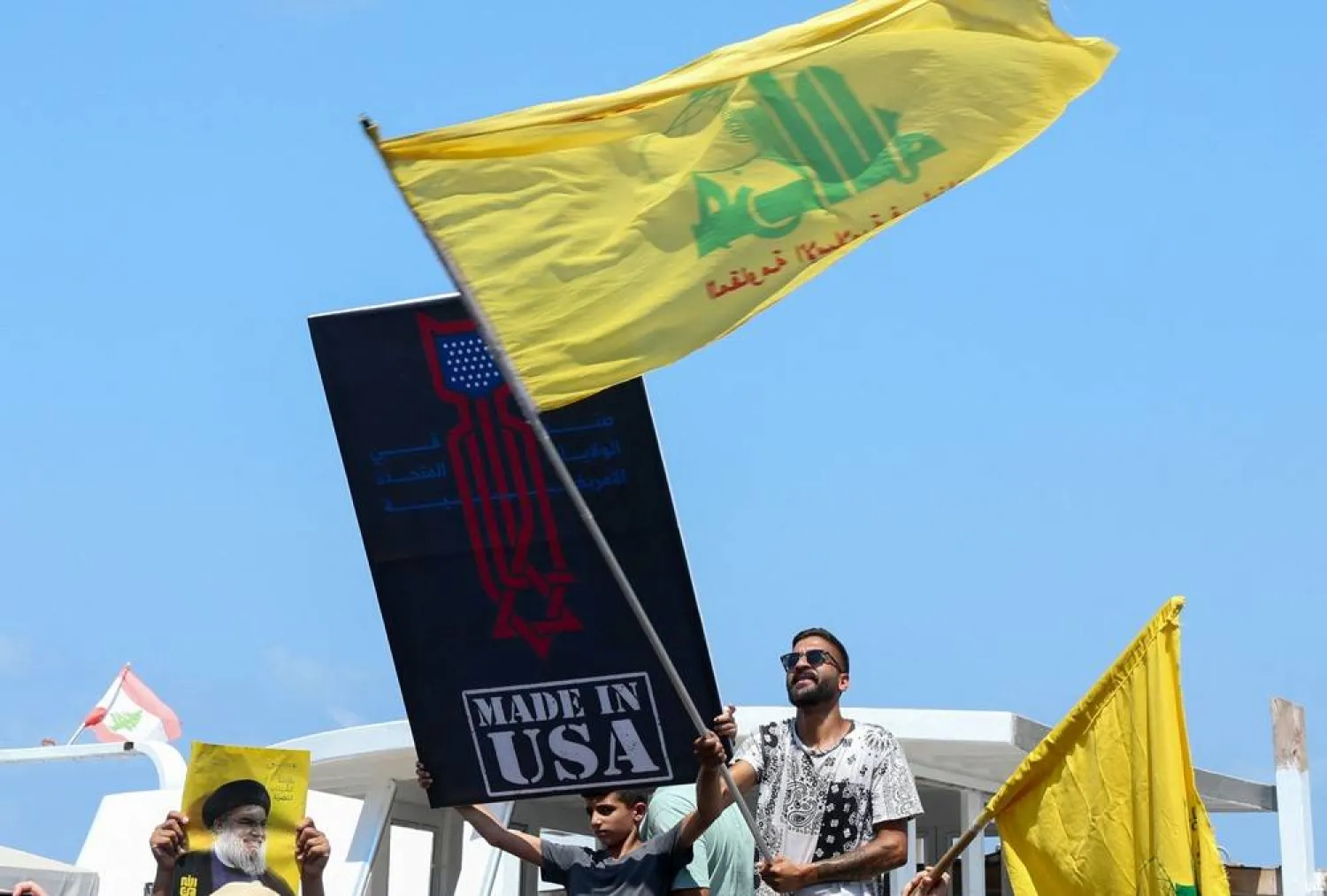 Hezbollah supporters protest against a planned visit of the US envoy to south Lebanon, on August 27, 2025, in Tyre. (AFP)