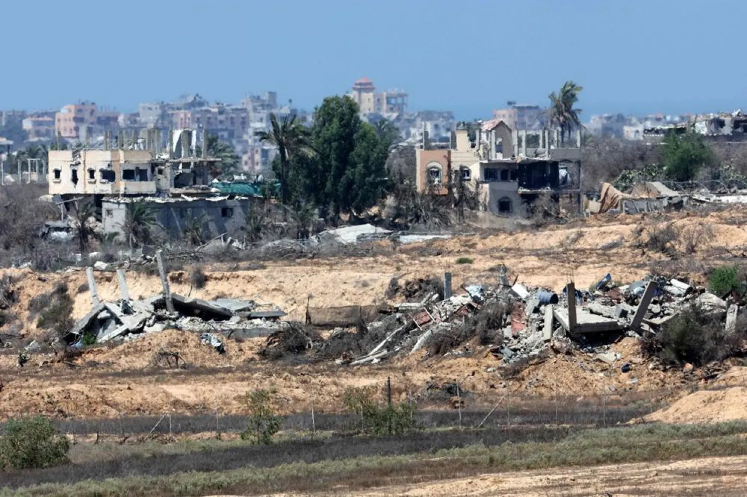 This picture taken from a position on the Israeli border with the Gaza Strip shows destroyed buildings in the embattled territory on August 27, 2025, amid the ongoing war between Israel and the Palestinian group Hamas. (AFP)