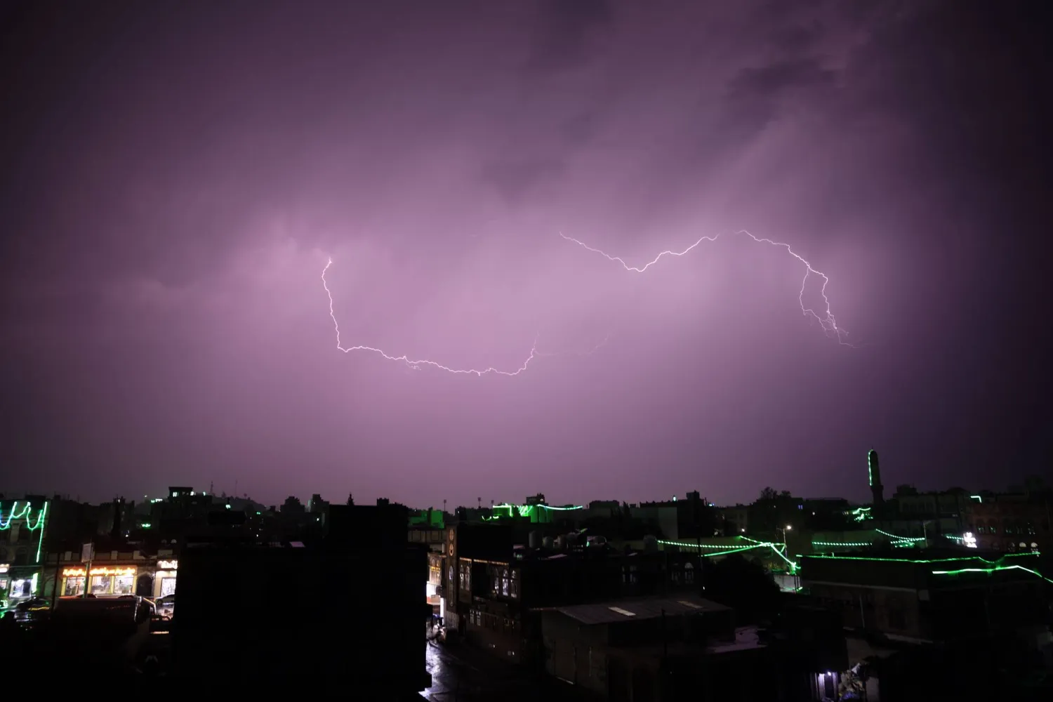 A stroke of lightning flashes across the sky during a thunderstorm over Sanaa, Yemen, 26 August 2025. EPA/YAHYA ARHAB