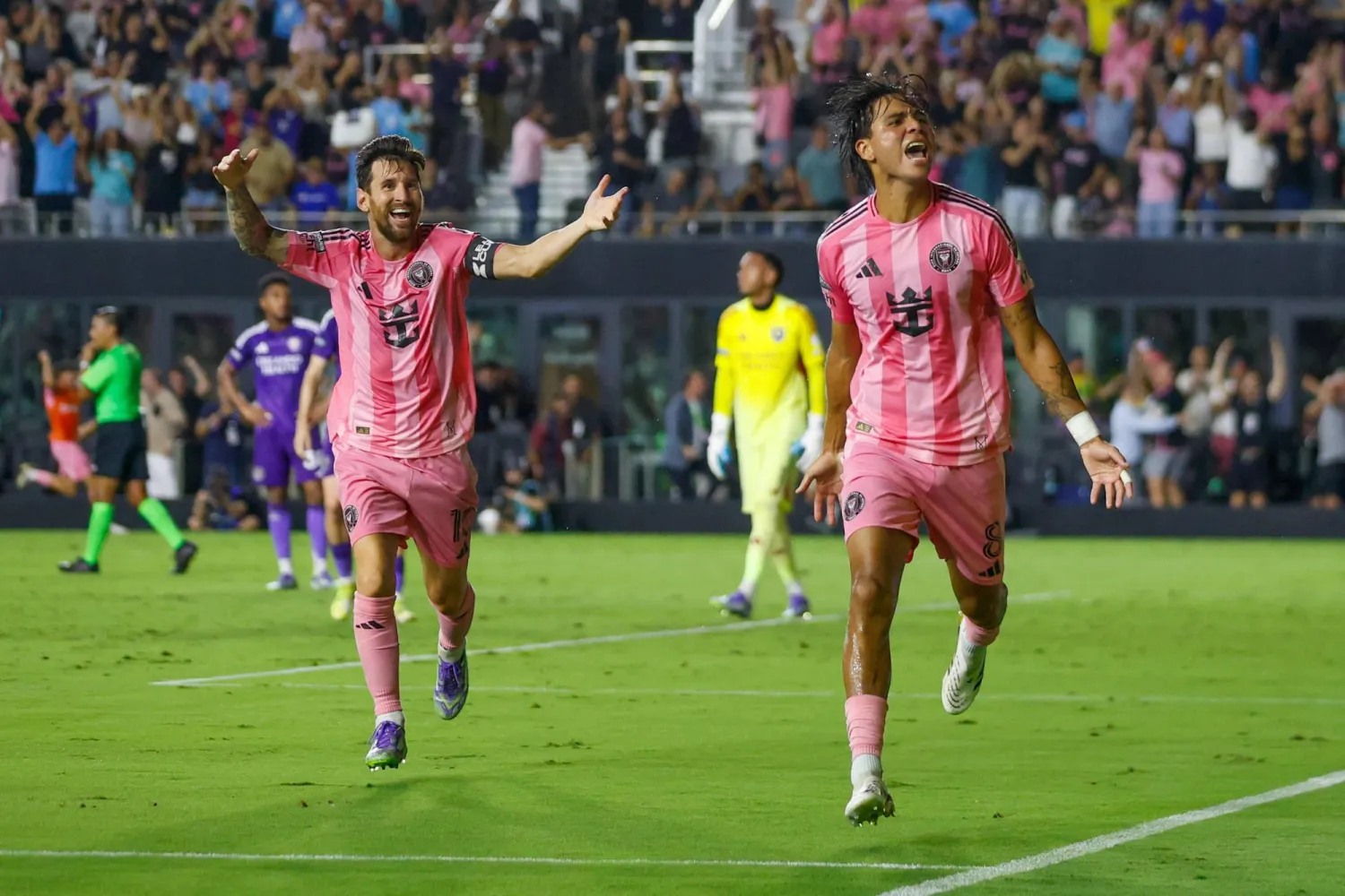 Inter Miami's Argentine forward #10 Lionel Messi and Inter Miami's Venezuelan midfielder #08 Telasco Segovia celebrate a third goal during the Leagues Cup semi-final football match between Inter Miami CF and Orlando City SC at Chase Stadium in Fort Lauderdale, Florida, on August 27, 2025. (Photo by Chris Arjoon / AFP)
